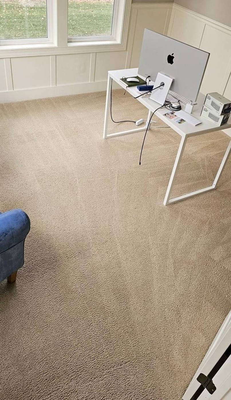 The same office carpet after cleaning, with the spotting gone