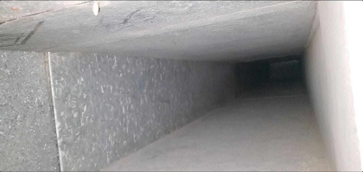 Inside an air duct after cleaning